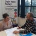 GDA staff member Brian Scott gives one to one advice to a young person, looking over paperwork on a table