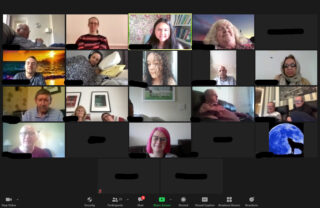 Group of members meditate