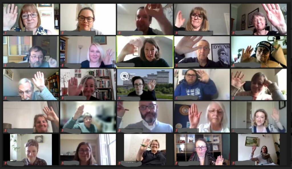 GDA members, disabled people led organisations and public and third sector allies raise their hands on zoom.