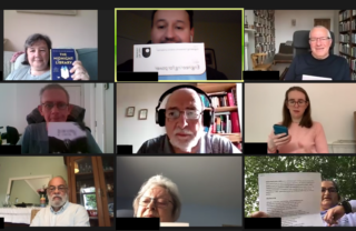 Picture shows 9 people holding up books, phones and stories