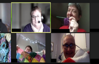 Picture of 8 people holding up craft projects