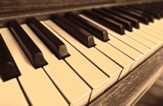 close up photograph of the keys of a piano