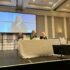 GDA's Dr Richard Brunner, Maree Todd, Minister for Social Care, Mental Wellbeing and Sport, and Tressa Burke, GDA CEO, sit at a table speaking into microphones.